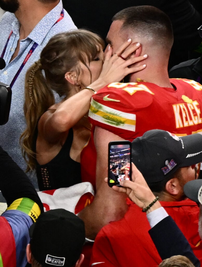 Taylor Swift and Travis Kelce kiss on February 11, 2024.