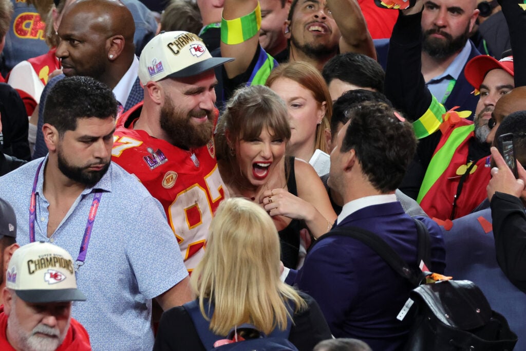 Travis Kelce #87 of the Kansas City Chiefs celebrates with Taylor Swift after defeating the San Francisco 49ers 25-22 in overtime during Super Bowl LVIII at Allegiant Stadium on February 11, 2024 in Las Vegas, Nevada. 