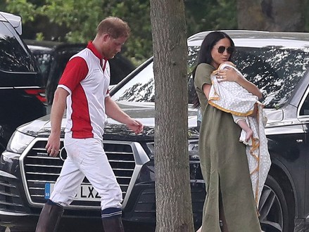 Britain's Prince Harry and Meghan, Duchess of Sussex walk with their son Archie at the Royal Charity Polo Day at Billingbear Polo Club, Wokingham, England Royals, Wokingham, United Kingdom - July 10, 2019